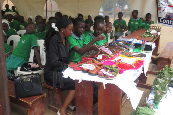 Learners showcasing creativity and innovation by making crafts from recycled materials