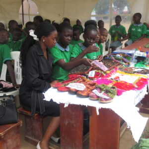 Learners showcasing creativity and innovation by making crafts from recycled materials