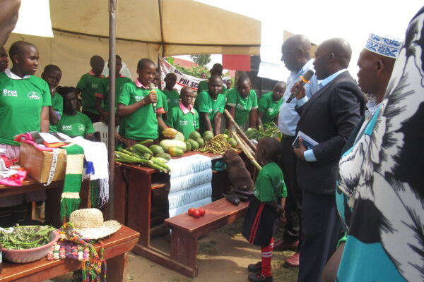 Youth exhibit various fruit plants cultivated in their permaculture gardens