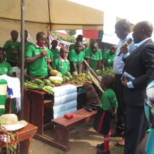 Youth exhibit various fruit plants cultivated in their permaculture gardens